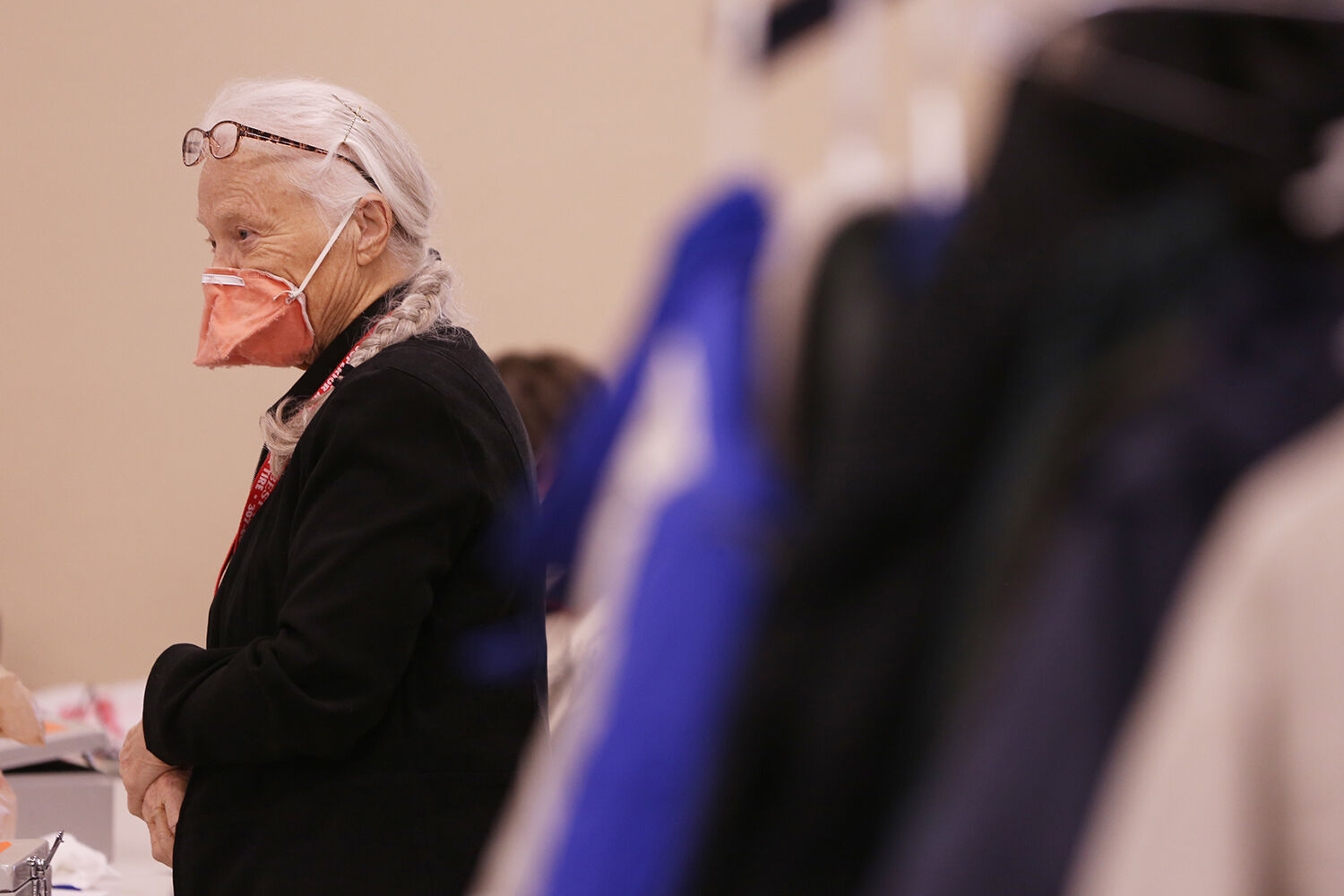 Peggy Stroble talks with a customer who is checking out